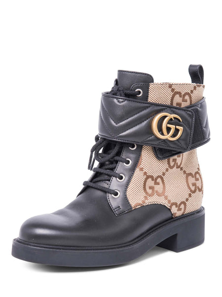Gucci motorcycle boot it’s a size 9 but it ran a size larger. Gucci GG Logo Leather Marmont Moto Boots Black Brown main image 2