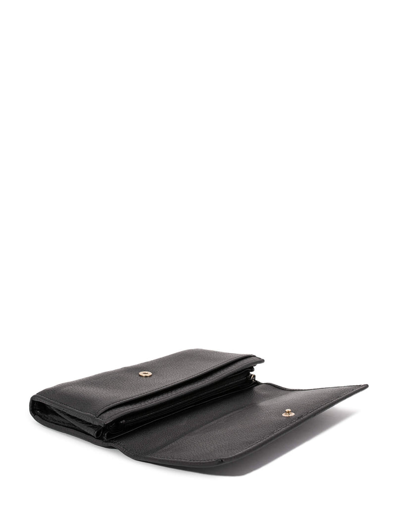 GG Embossed Passport Holder in Black - Gucci